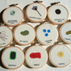 Illustration for article titled Cross-Stitched Microbes Let You Hang Your Favorite Germs on the Wall